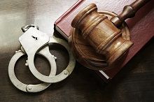 Gavel and cuffs - criminal defense